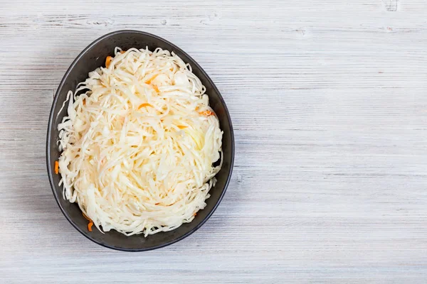View of sauerkraut in bowl on gray with copyspace — Stock Photo, Image