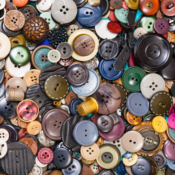 Heap of many various buttons close up on blue — Stock Photo, Image