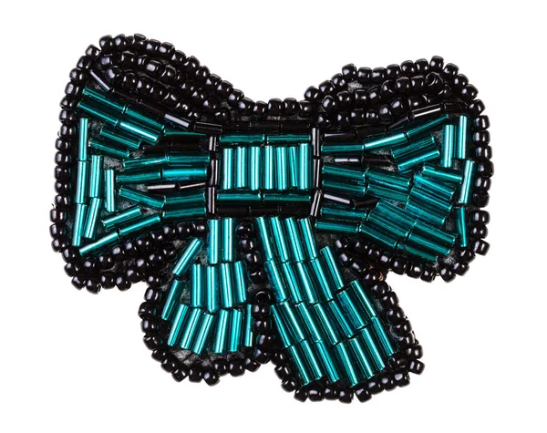 Bow tie brooch from green bugles and black beads — Stock Photo, Image