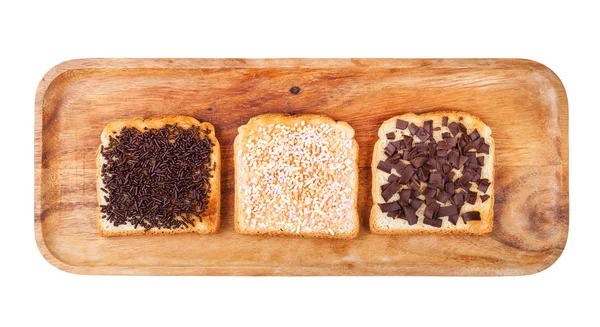 Diverse toastjes met chocoladehagelslag op bord — Stockfoto