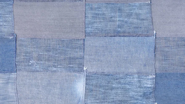 Patchwork aus vielen alten blauen Jeansklappen — Stockfoto