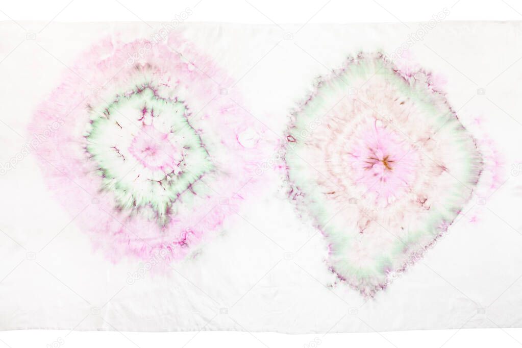 fragment of white silk scarf with abstract ornament in tie-dye batik technique isolated on white background