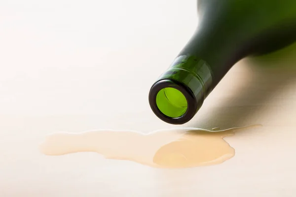 Bottleneck Cognac Bottle Spilled Liquid Wooden Board Close — Stock Photo, Image