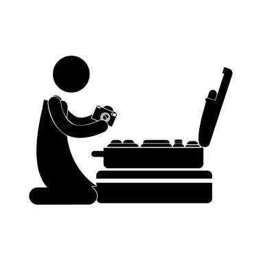 kamera ve Bagaj ile diz çökmüş kişi