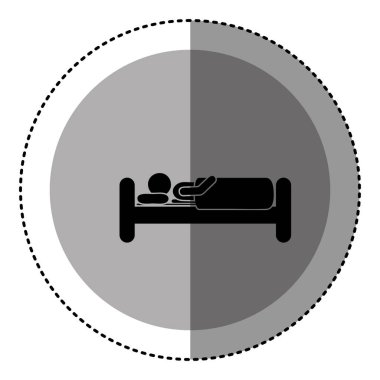 etiket tek renkli dairesel amblemi ile kişi yatakta