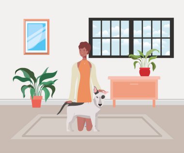 Salonunda sevimli köpeği olan genç bir kadın var.