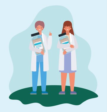 İlaç kavanozu tasarlayan kadın ve erkek doktorlar.