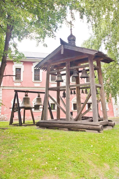 Bell in park of an ancient monastery — Stock Photo, Image