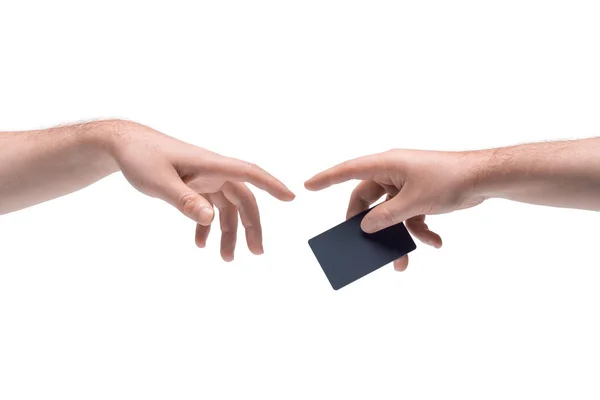 Deux mains masculines se passant une réduction en plastique noir ou carte de crédit sur fond blanc — Photo