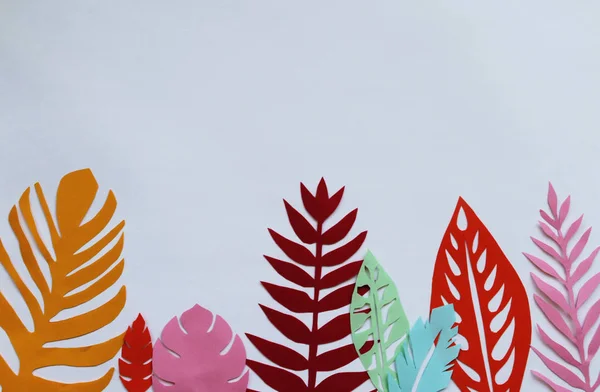 colorful paper leaves on the white background