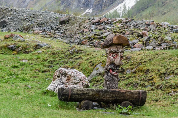 Carved fountain in mountains — Stock Photo, Image