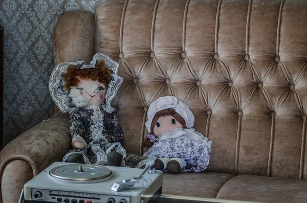 Two dolls on sofa — Stock Photo, Image
