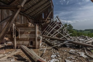 thresher in a collapsed loft