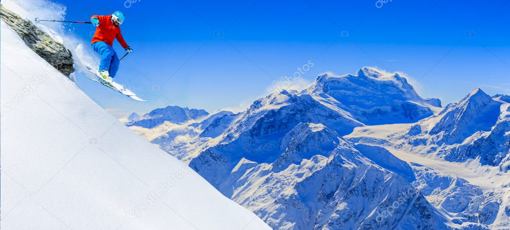 Skiing with amazing view of swiss famous mountains in beautiful winter snow. The matterhorn and the Dent d'Herens. In the background Castor and Pollux. In the foreground the Grand Desert glacier.