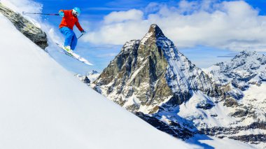 Man skiing with Matterhorn in background clipart