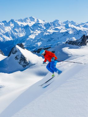 Man skiing downhill Alps mountain clipart