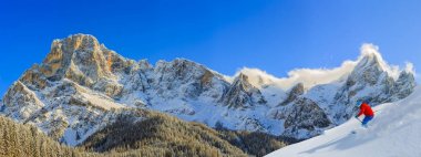 Skiing with amazing panorama of Pale di Sant Martino di Castrozz clipart