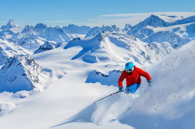 Skiing with amazing view of swiss famous mountains in beautiful  clipart