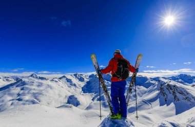 Skiing with amazing view of swiss famous mountains in beautiful  clipart