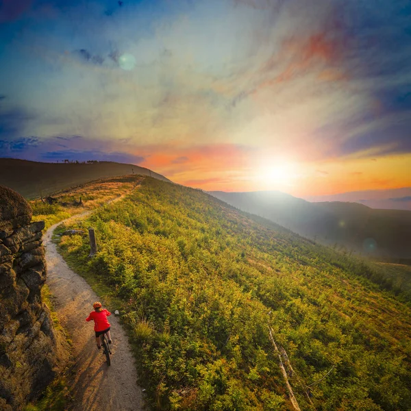 Mountain biking cycling at sunset in summer mountains forest lan — Stock Photo, Image