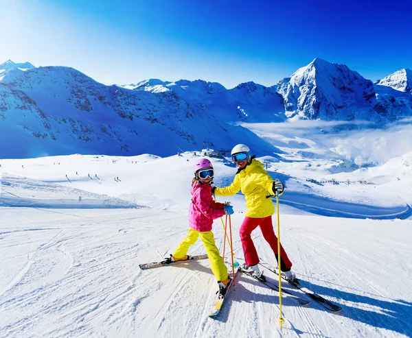 Happy family enjoying winter vacations in mountains. Playing wit — Stock Photo, Image