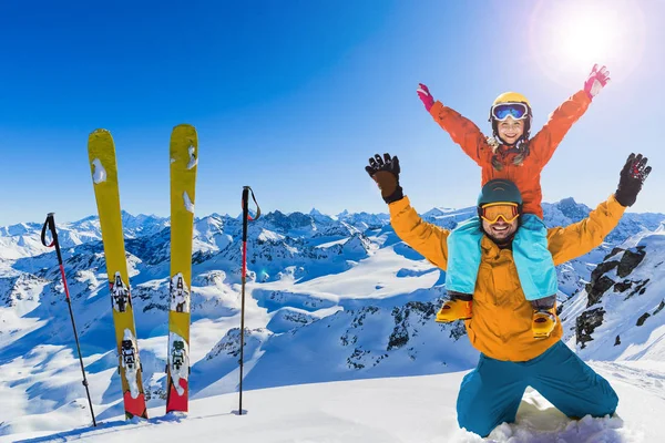 Happy family enjoying winter vacations in mountains. Playing wit — Stock Photo, Image