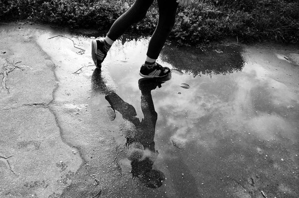 Girl running on the pavement