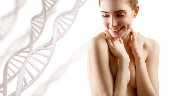 Young naked woman cover breasts among DNA chains. — Stock Photo, Image