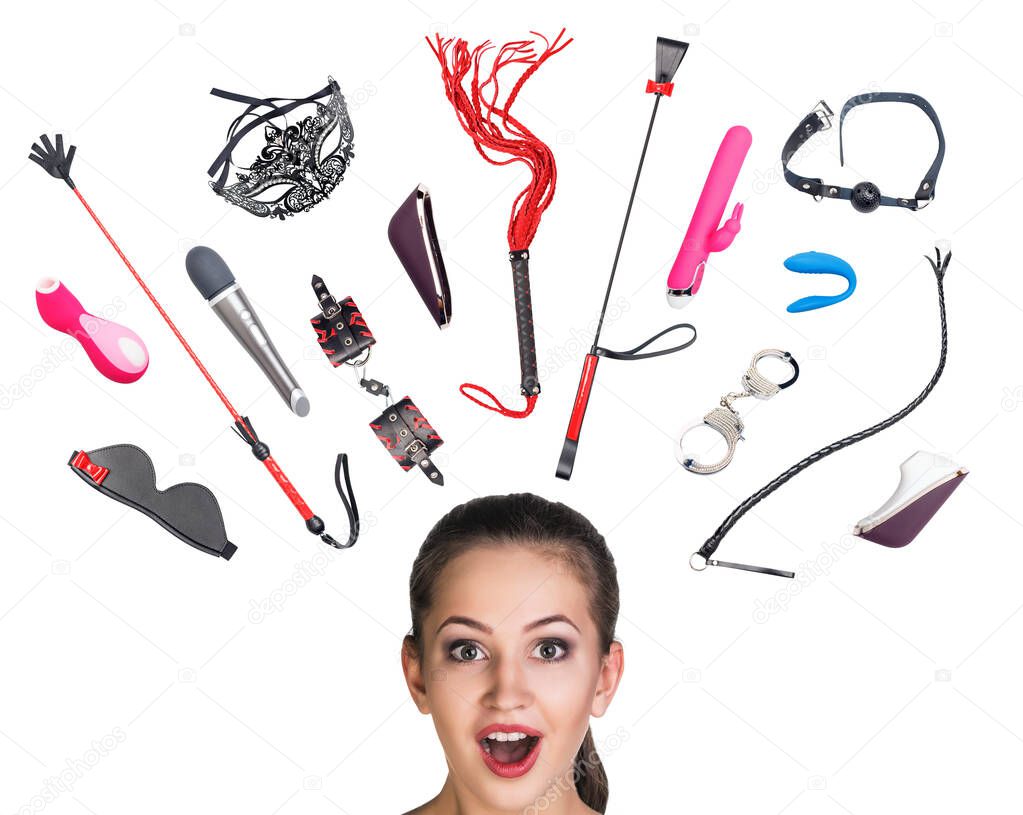 Many sexual toys over head of surprised woman.
