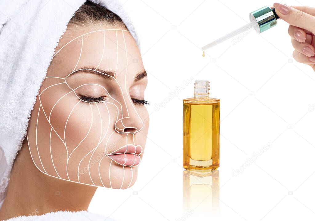 Cosmetic oil applying on young woman with lifting lines.