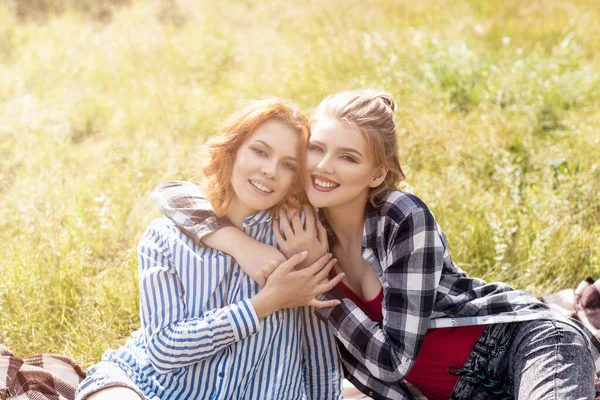 Young beautiful women on picnic in summer park. — Stock Photo, Image