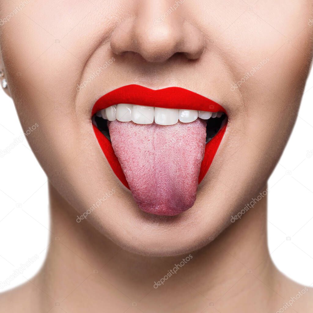 Close-up portrait of woman with red lips shows tongue.