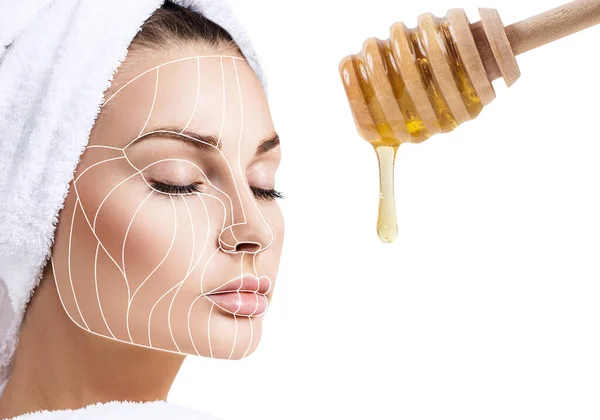 Cara femenina con líneas de elevación cerca fluye hacia abajo miel . —  Fotos de Stock