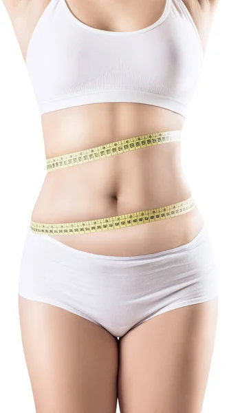 Mulher após perda de peso medindo sua barriga . — Fotografia de Stock