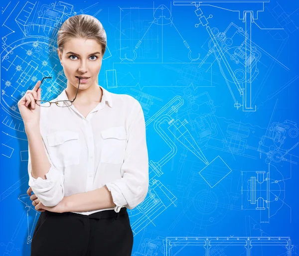 Young business woman present blueprint. — Stock Photo, Image
