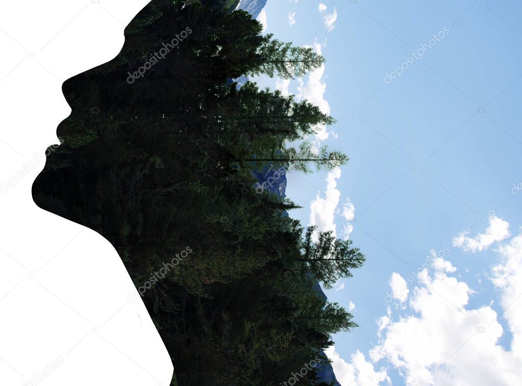 Double exposure of woman in profile and forest.