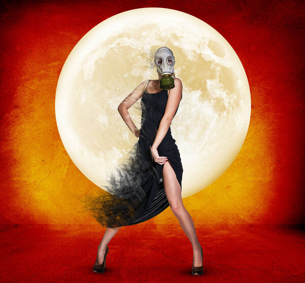 Stylish young woman in gas mask over full moon background.
