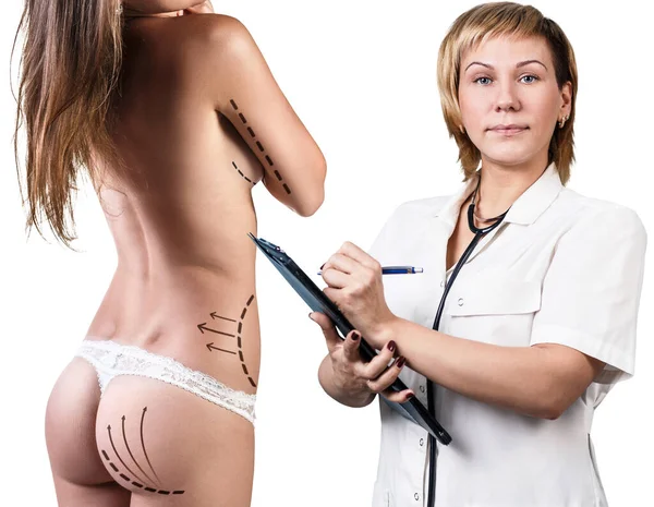 Young woman with plastic arrows with surgeon. — Stock Photo, Image