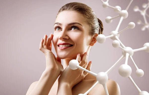 Young woman with big white molecule chain. — Stock Photo, Image