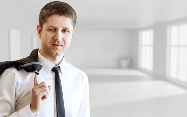 Businessman in the white empty office background. — Stock Photo, Image