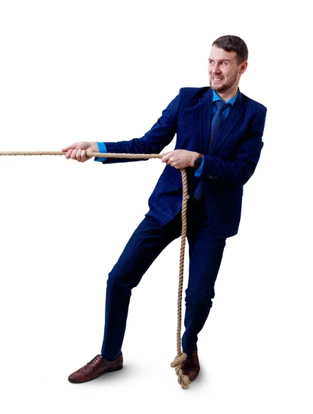 Joven hombre de negocios tira de una cuerda . — Foto de Stock