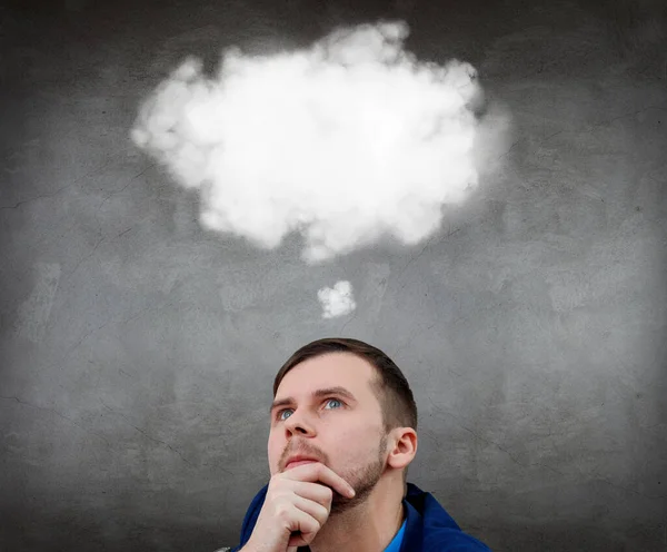 Geschäftsmann sitzt mit weißer Wolke über dem Kopf auf dem Boden. — Stockfoto