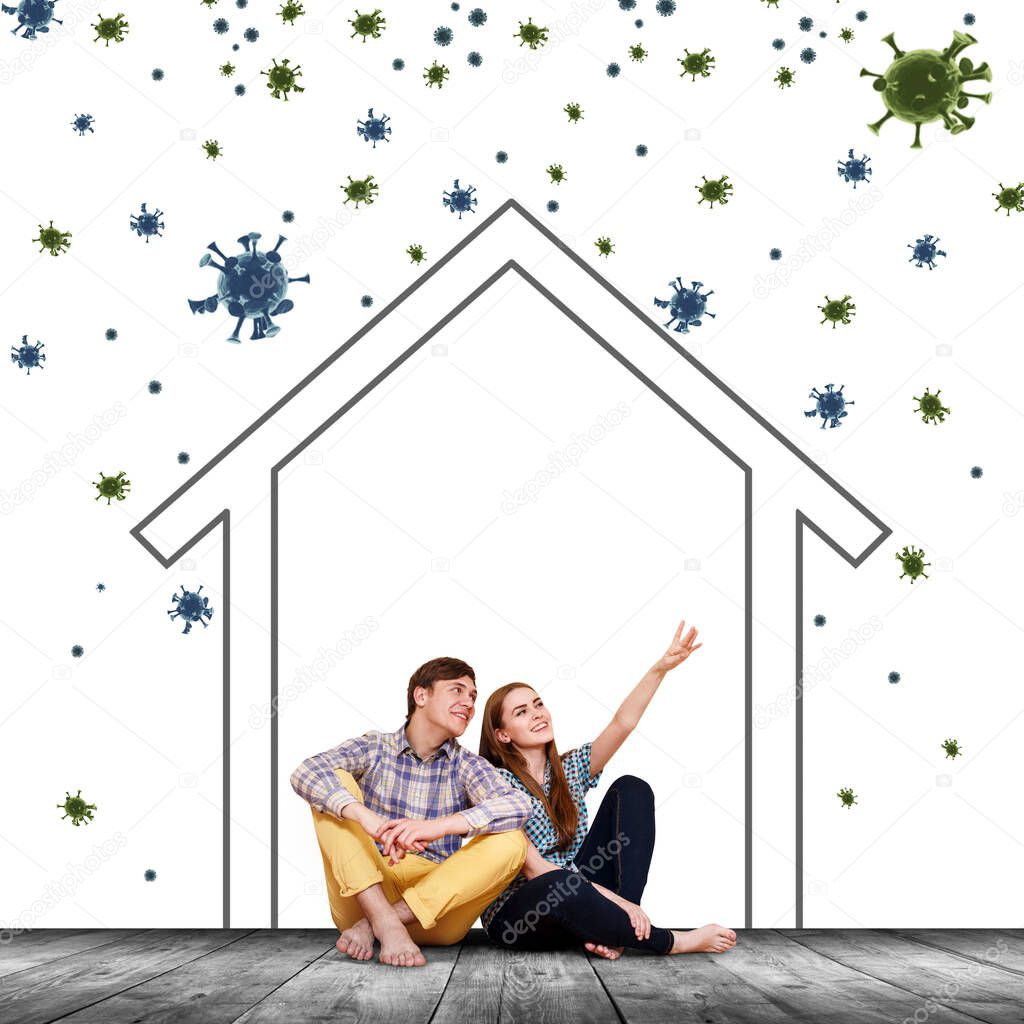 Couple sitting on the floor with paint home among coronavirus cells.