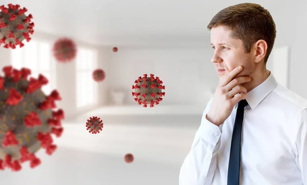 若い思慮深いビジネスマンは、コロナウイルス細胞を見て. — ストック写真