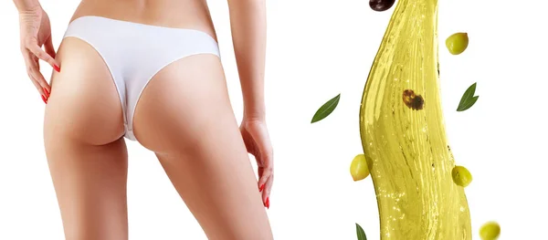 Nalgas femeninas cerca de salpicaduras de aceite de oliva. Concepto de adelgazamiento y dieta . — Foto de Stock