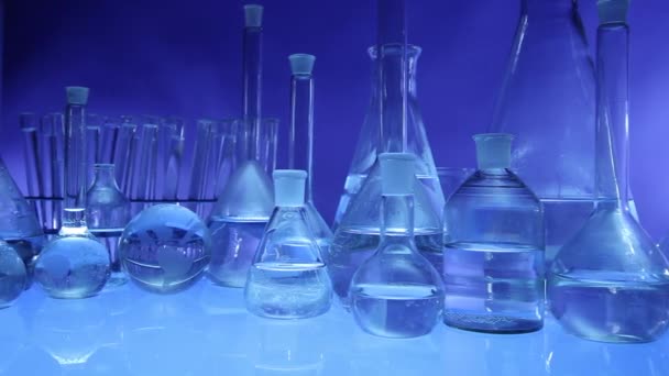 Modern Laboratory Equipment Set Different Glassware Blue Background Dolly Shot — Stock Video