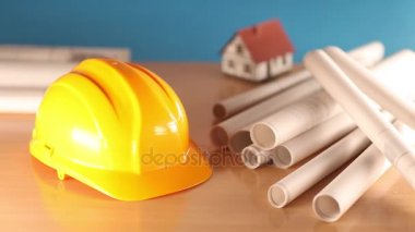 Emlak geliştirme ve gelişim planı. Evin altında inşaat, planları ve kask, rullers. 