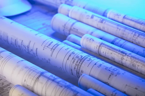 Workplace of architect. Rolls of blueprints. Place for text.