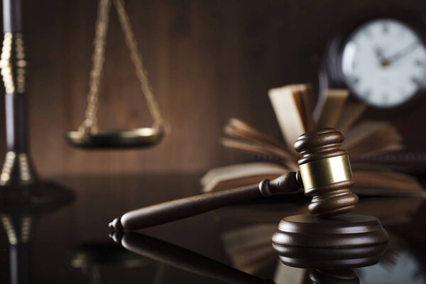 Legal office concept. Gavel, book, scale and clock.