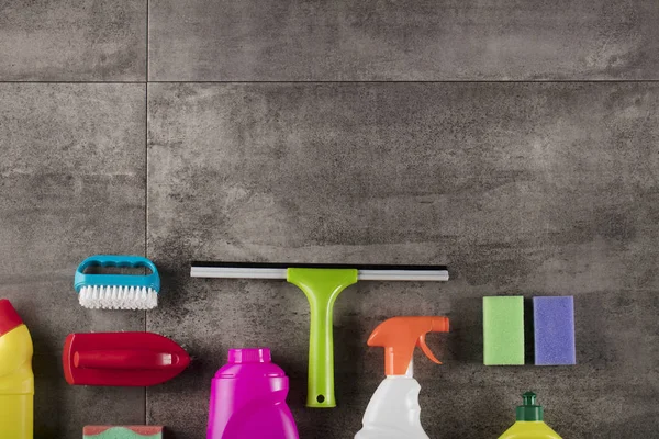 Spring Cleaning Concept Colorful Cleaning Products Gray Tiles Place Typography — Stock Photo, Image